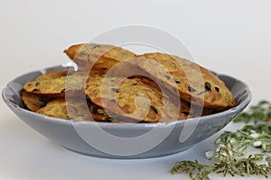 Deep fried Indian flat bread made of whole wheat flour, cooked lentils and moringa leaves and spices