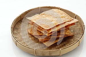 Kerupuk Bawang or Crsipy Fried Dumpling Skin photo