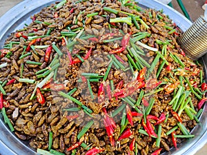 Deep-fried larves in the street market of Siem Reap