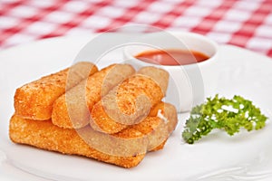 Deep-fried mozzarella cheese sticks photo