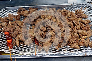 Deep fried pork liver with breading sold at a street food stall photo