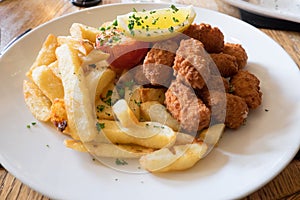 Deep fried scamp and chips pub meal in England