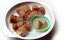 Deep fried shishamo fish on white background