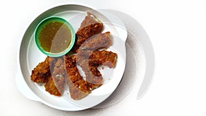 Deep fried shishamo fish on white background