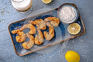 Deep-fried shrimp in batter. Natural delicious food. Greek cuisine menu. Still life in a marine style.