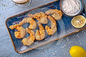 Deep-fried shrimp in batter. Natural delicious food. Greek cuisine menu. Still life in a marine style.