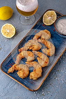 Deep-fried shrimp in batter. Natural delicious food. Greek cuisine menu. Still life in a marine style.