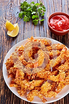 Deep-fried shrimps on a white plate