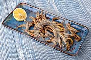 Deep-fried smelt. Natural delicious food. Greek cuisine menu. Still life in a marine style