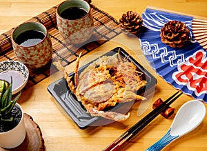 deep fried soft shell crab served in dish with black coffee side view of taiwan food