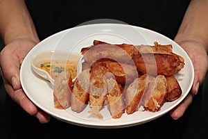 Deep fried spring roll as flour sheet wrap  fried vermicelli served with sweet sauce