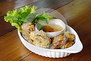 Deep fried spring rolls serving with plum sauce