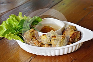 Deep fried spring rolls serving with plum sauce