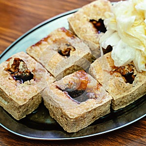 Deep fried stinky tofu with pickled cabbage, famous and delicious street food in Taiwan