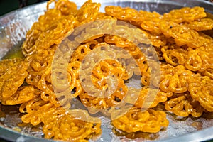 Deep fried sweets on sale in a homemade food market sal in the streets of Varanasi, India