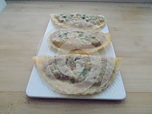 deep-fried traditional Asian pies with fish and vegetables