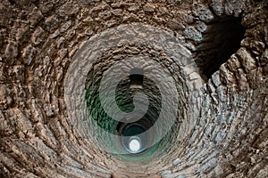 Deep medieval moorish well photo