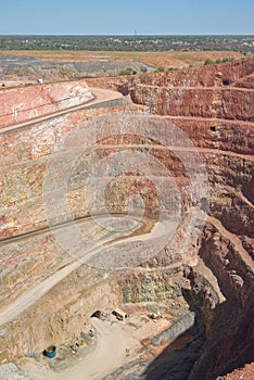 Deep mine hole in rock strata photo