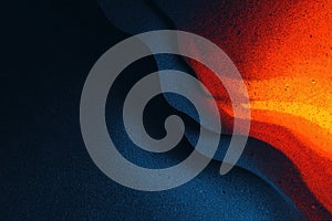 Deep navy layered cliffs with fiery accents.