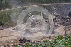 Deep open pit mine hole in a quarry .