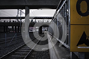 Deep perspective of rails at a tram station photo