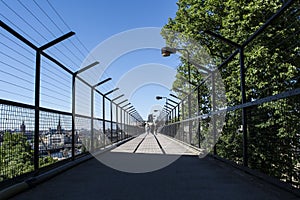 Deep perspective of a walkway with high fences