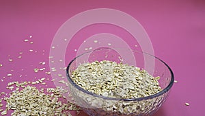 Deep plate with oatmeal inside on a lilac background photo