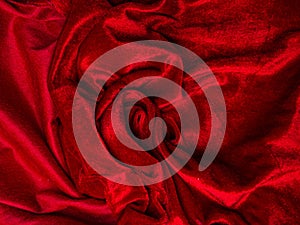 Deep red velvet texture for background, red rose shape, love and passion concept. very affectionate and passionate. Soft fabric photo