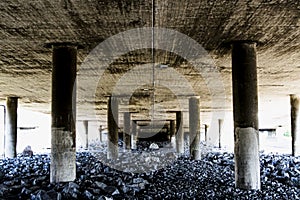 Deep and rough perspective from under a concrete bridge