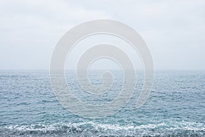 Deep sea water waves and stormy sky