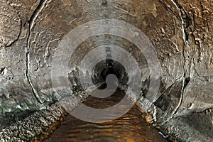 Deep sewage tunnel with poinson flowing