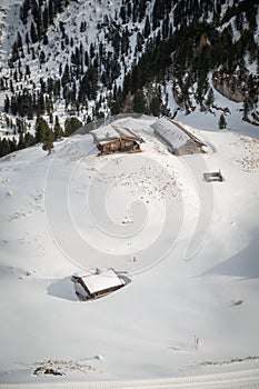 Deep snow pack covering houses and roads of an alpine village