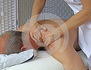 Deep tissue massage to Trapezius muscle photo