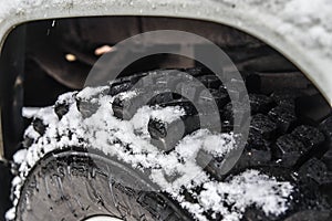 deep tyre tread on a roadworthy tyre with snow