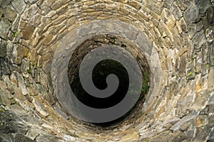 Deep water well in the town, inside. Slovakia