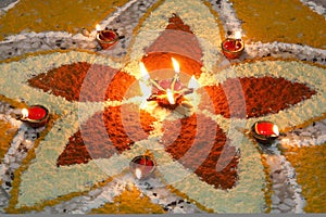 Deepak with colourful rangoli