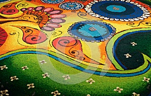 Deepak with colourful rangoli