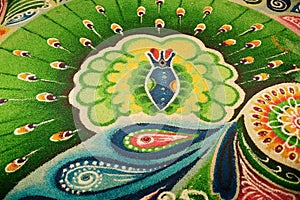 Deepak with colourful rangoli