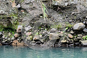 Deeply eroded river bank due to previous flooding