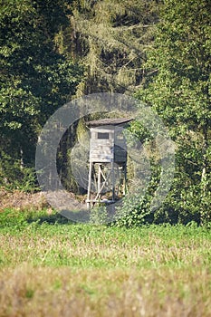 Deer hunting tower by a forest, selective focus