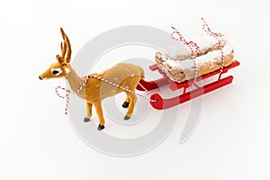 Deer Pulling a Sledge with Stollen Isolated on White