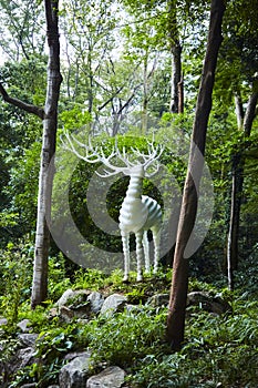 Deer`s monument in a forest