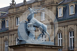 Deer sculpture with crest in front of the main entrance of the New Castle Neues Schloss in Germany, Stuttgart