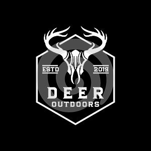 Deer skull vintage logo outdoor adventure design template vector illustration