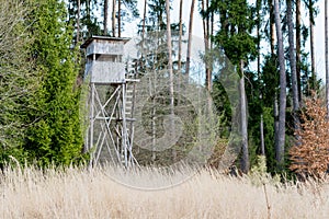 A deer stand in front of a meadow in the Natural Reserve schoenbuch in Germany