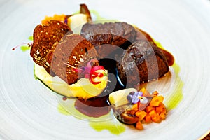 Deer tenderloin. Truffle-potato puree, porcini mushrooms, baked leek and carrot, juniper bread, port wine sauce