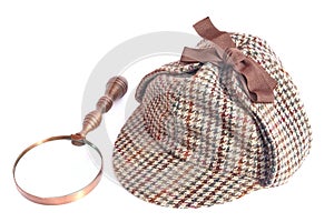 Deerhunter or Sherlock Holmes cap and vintage magnifying glass