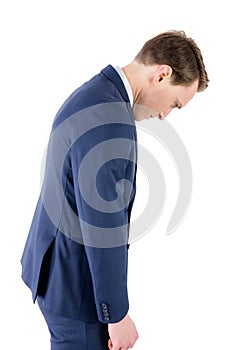 Defeated businessman looking down