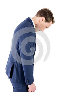 Defeated businessman looking down photo