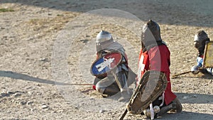 Defeated knights is on the ground in dust Waiting for the end of battle